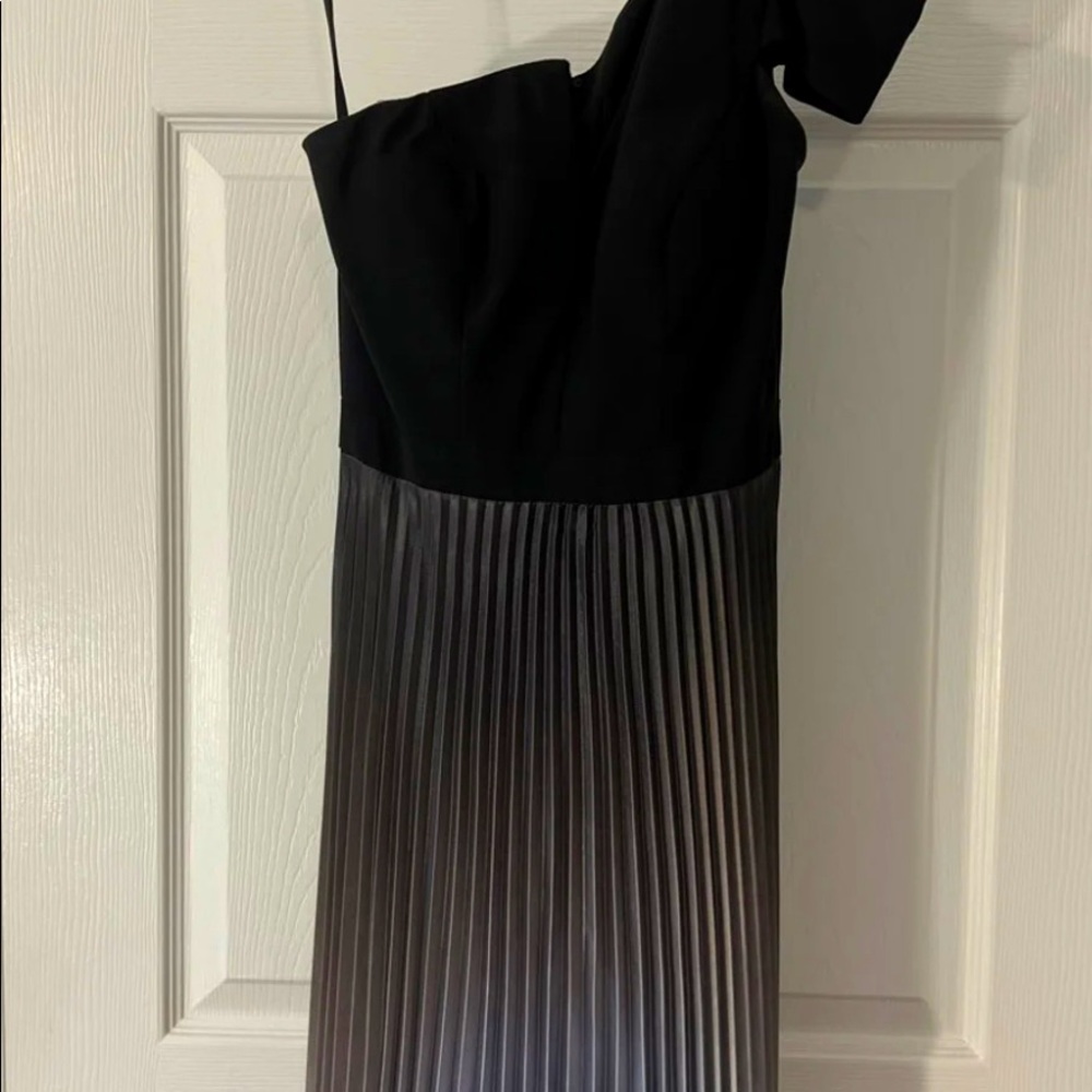 .  Fitted through bust and waist; relaxed fit through hips
• Mid-stretch fabric